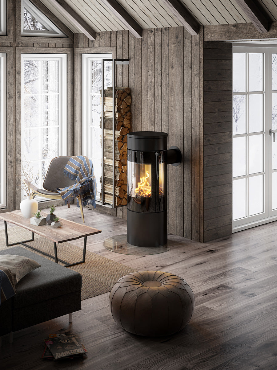 Side view of the RAIS Viva L 120 wood burning stove showcasing its curved glass door and sleek design.