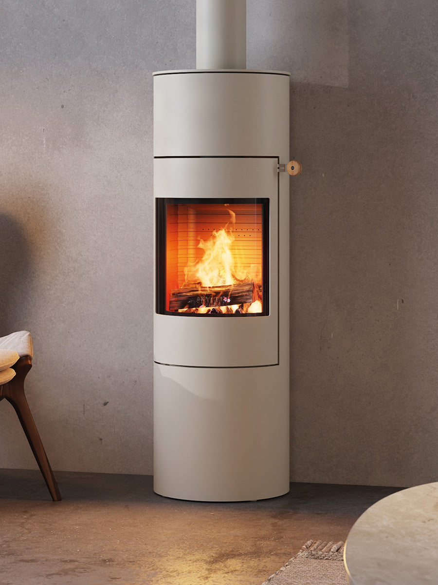 Side view of the RAIS Viva L 140 wood burning stove with a glass door, showcasing its curved design and sleek finish.