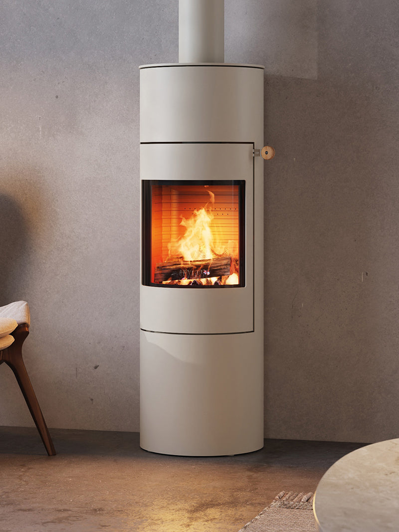 Side view of the RAIS Viva L 140 wood burning stove with a glass door, showcasing its curved design and sleek finish.