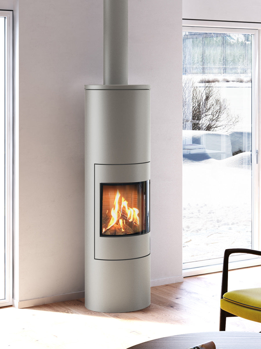 Round RAIS Viva L 160 gas fire stove with glass door, showcasing steady flames and elegant design in a modern living space.