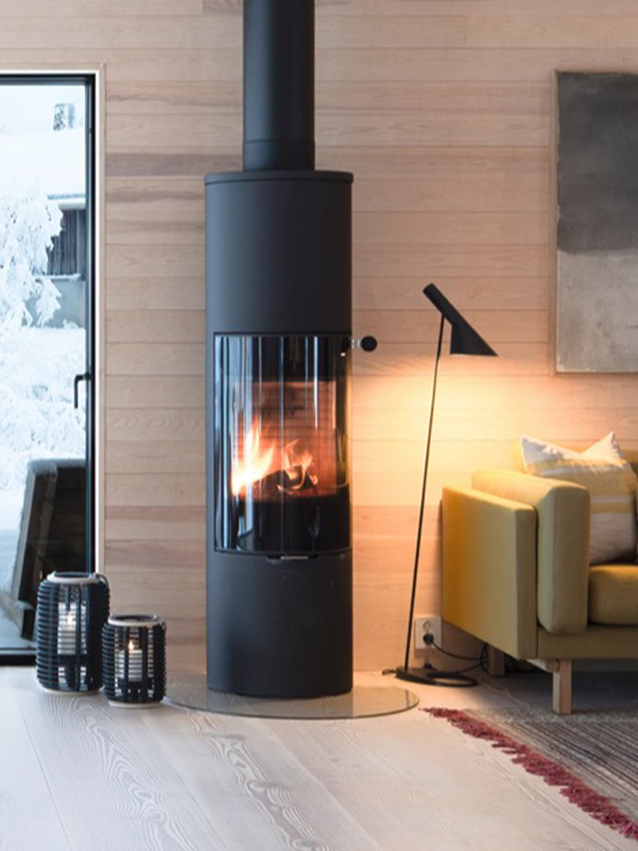 Round RAIS Viva L 160 wood burning stove with a glass door, showcasing a sleek design and panoramic flame view.