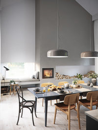 Front view of Rais 600 1 inset wood burning stove with large glass panes and sleek steel frame.