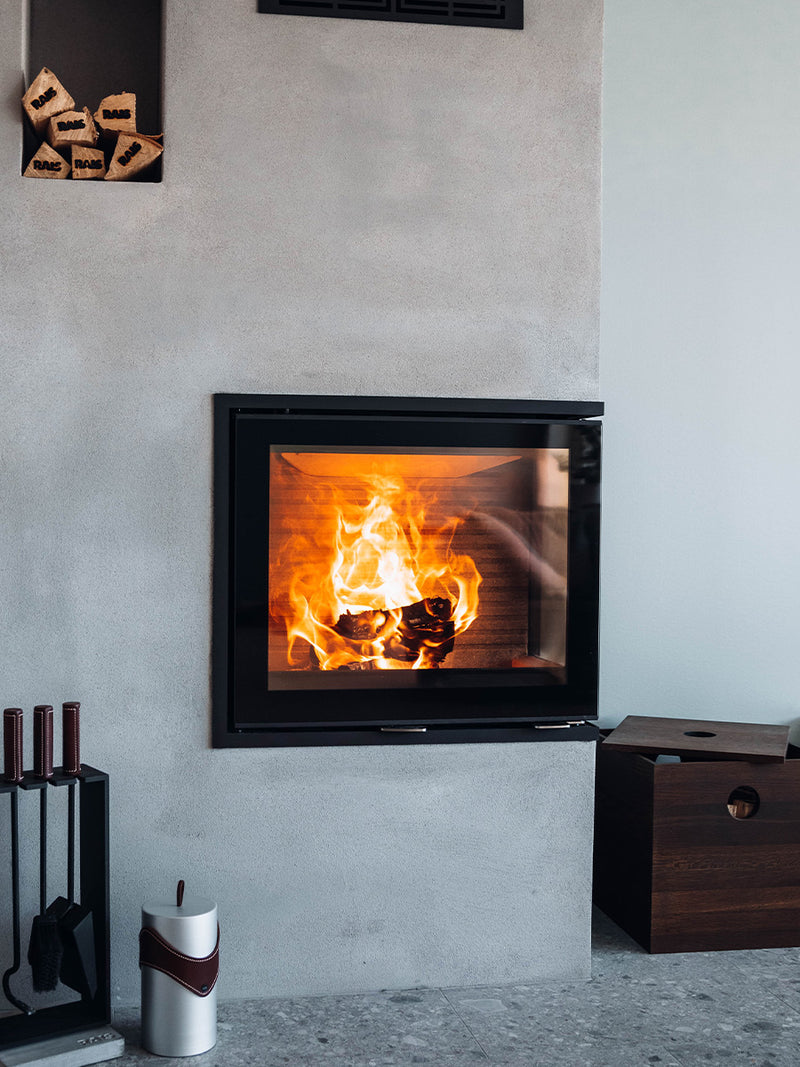 Corner view of the Rais 600 2 Inset wood burning stove with two large glass panes and sleek black finish.