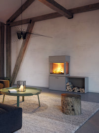 RAIS 600 Max wood burning stove with steel door, featuring elegant design and storage box, shown from the front view.