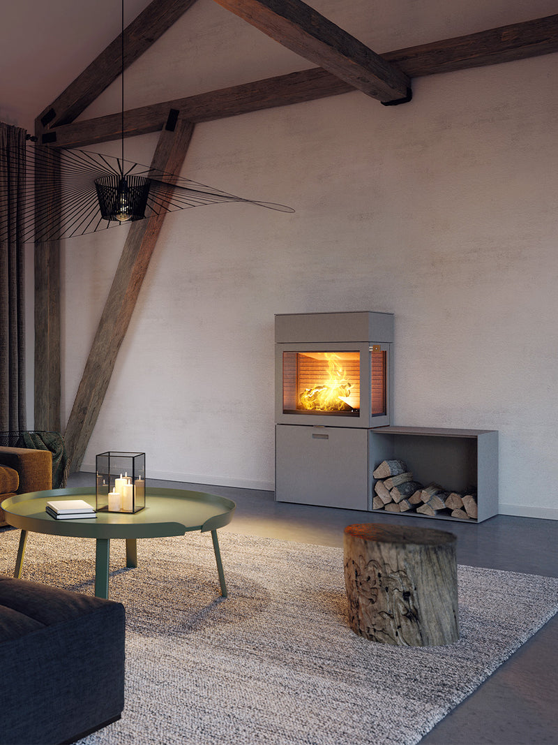 RAIS 600 Max wood burning stove with steel door, featuring elegant design and storage box, shown from the front view.