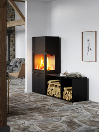 Side view of RAIS 600 Max wood burning stove with steel door and two storage boxes, showcasing elegant design and features.