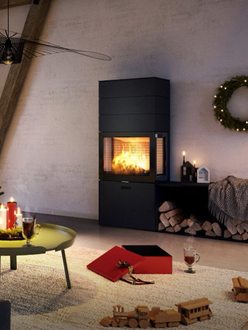 RAIS 600 Max wood burning stove with steel door and three storage boxes, showcasing elegant design and room divider feature.